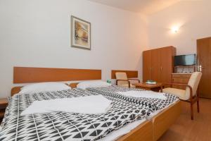 Säng eller sängar i ett rum på Apartments Obradović
