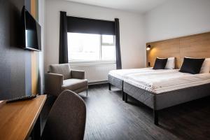 Postel nebo postele na pokoji v ubytování 201 Hotel