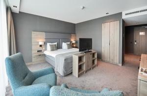 Postel nebo postele na pokoji v ubytování Van der Valk Hotel Leeuwarden