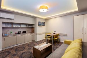 a living room with a couch and a table at Plaza35 in Sibiu