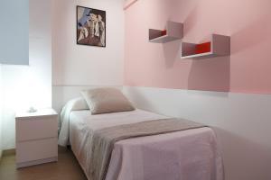 Postel nebo postele na pokoji v ubytování UHC Scala Mar Apartments