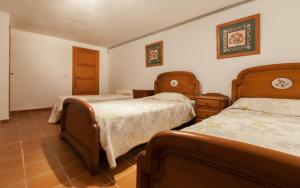 A bed or beds in a room at Almadrava