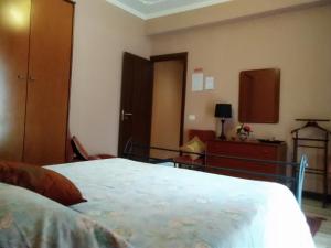 A bed or beds in a room at B&B "Al Calopinace"