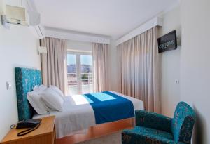 Postel nebo postele na pokoji v ubytování Hotel D. Dinis