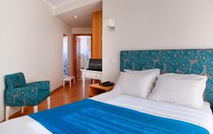 Postel nebo postele na pokoji v ubytování Hotel D. Dinis