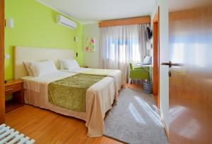 Postel nebo postele na pokoji v ubytování Hotel D. Dinis