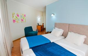 Postel nebo postele na pokoji v ubytování Hotel D. Dinis