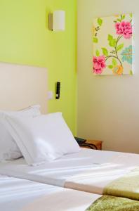 Postel nebo postele na pokoji v ubytování Hotel D. Dinis