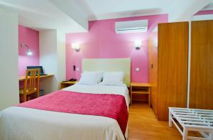 Postel nebo postele na pokoji v ubytování Hotel D. Dinis