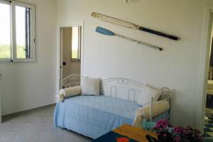 A bed or beds in a room at Casa Serradei