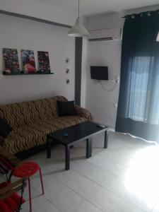 Posezení v ubytování City Apartment