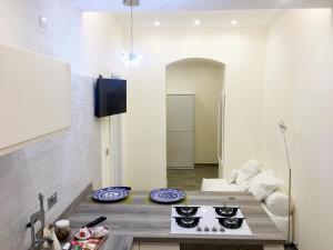 ミラッツォにあるGiò Galà Relaisのキッチン(テーブル、コンロ付) +47枚の写真