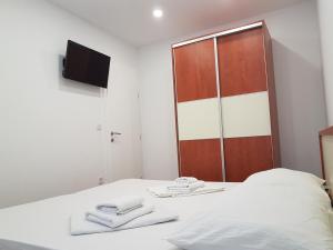 Postel nebo postele na pokoji v ubytování Apartments Vinko