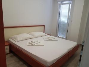 Postel nebo postele na pokoji v ubytování Apartments Vinko