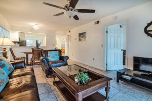 a living room with a couch and a table at Luxury Shorewalk Water Front 2 Bedroom 2 Bathroom 3Mins IMG 5 Mins Beach in Bradenton Beach