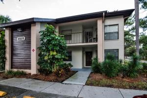 a apartment building with a balcony and plants at Luxury Shorewalk Water Front 2 Bedroom 2 Bathroom 3Mins IMG 5 Mins Beach in Bradenton Beach