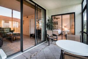 a living room with sliding glass doors at Luxury Shorewalk Water Front 2 Bedroom 2 Bathroom 3Mins IMG 5 Mins Beach in Bradenton Beach