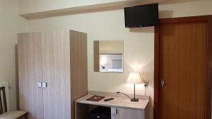 TV a/nebo společenská místnost v ubytování Aparthotel Amelia Dream View