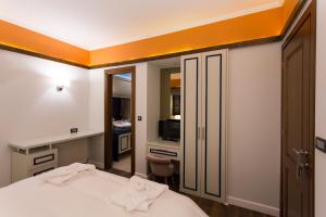 A bed or beds in a room at Abi Luxury Villas