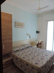 Postel nebo postele na pokoji v ubytování Hotel Liliana