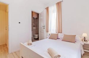 Postel nebo postele na pokoji v ubytování Villa Augustina