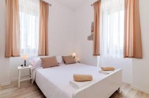 Postel nebo postele na pokoji v ubytování Villa Augustina