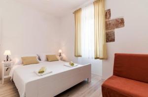 Postel nebo postele na pokoji v ubytování Villa Augustina