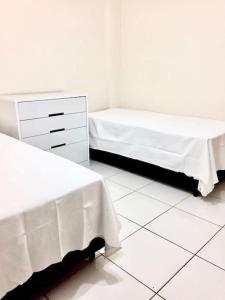 Cama ou camas em um quarto em Morada Center