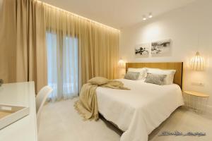 Postel nebo postele na pokoji v ubytování Alfa Hotel