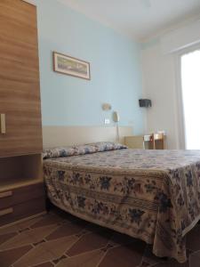 Postel nebo postele na pokoji v ubytování Hotel Liliana