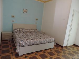 Postel nebo postele na pokoji v ubytování Hotel Liliana