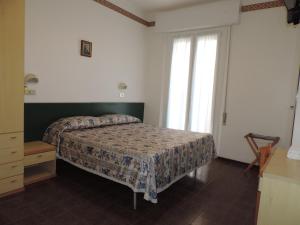 Кровать или кровати в номере Hotel Liliana