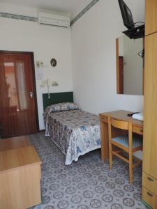 Postel nebo postele na pokoji v ubytování Hotel Liliana