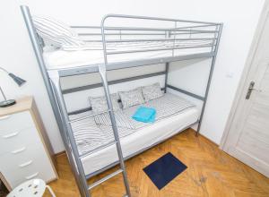Postel nebo postele na pokoji v ubytování UWH Hostel