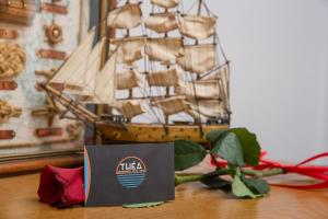 a model of a ship sitting on a table at Théa Apartment in Kavála +49 photos