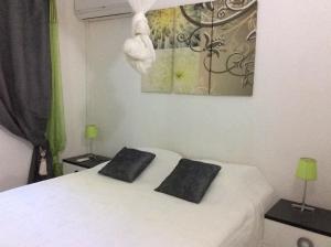Katil atau katil-katil dalam bilik di Villa Acajou