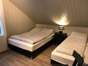 Postel nebo postele na pokoji v ubytování Lava Guesthouse