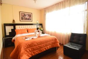 Rúm í herbergi á Tambo Cusco Inn