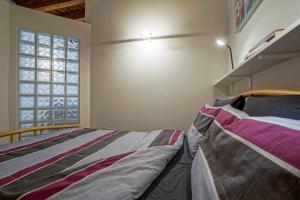 Кровать или кровати в номере Appartamento al Duomo