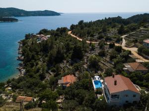 an aerial view of a house next to the water at Villa Matic in Vela Luka