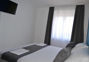 Posteľ alebo postele v izbe v ubytovaní VILLA ŠUŠANJ 1