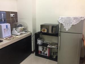 Kuchyň nebo kuchyňský kout v ubytování Homestay at Lagoon Park Resort