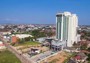 an aerial view of a city with a tall building at Muong Thanh Luxury Vientiane Hotel in Vientiane