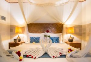 Letto o letti in una camera di Ulun Ubud Resort - CHSE Certified