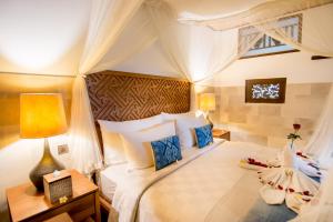 Letto o letti in una camera di Ulun Ubud Resort - CHSE Certified