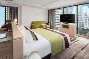 Postel nebo postele na pokoji v ubytování Solitaire Bangkok Sukhumvit 11