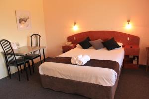 Postel nebo postele na pokoji v ubytování Childers Gateway Motor Inn