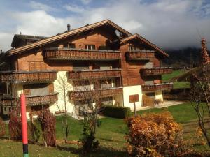 a large building with balconies on the side of it at Haus am Golfplatz in Selfranga