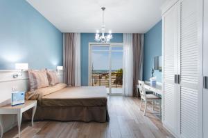 Postel nebo postele na pokoji v ubytování Hotel Nettuno