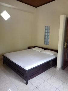 A bed or beds in a room at Mimba Private House